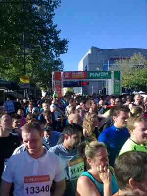 Crowds of runners gather beyond the finish line