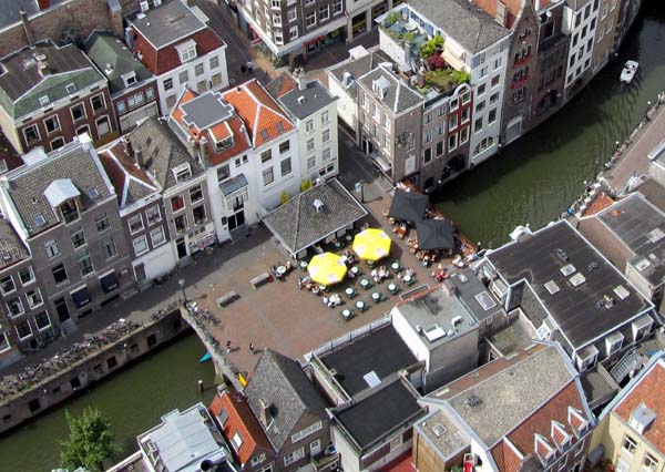 Looking down on a city canal lined with old buildings