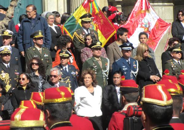 Politicians and military leaders on the steps of a Government building
