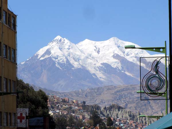 Snow-covered Illimani viewed from a street in central La Paz