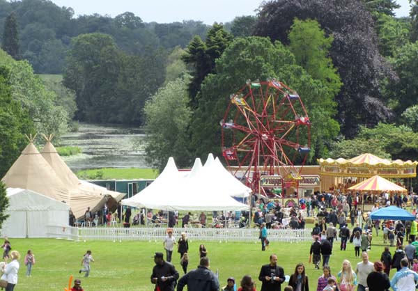 The fairground in the grounds of Warwick Castle by the River Avon