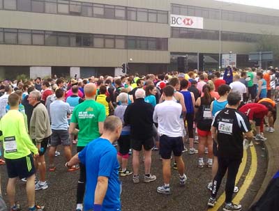 A crowd of runners in a city street