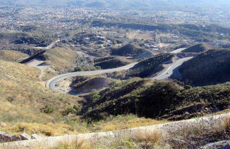 Hairpin bends leading down to a town