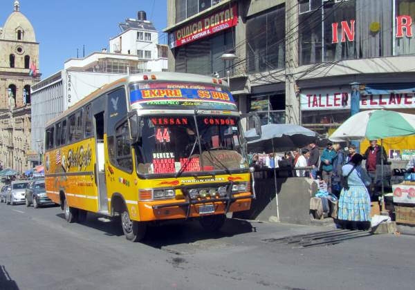 A small, brightly-coloured bus