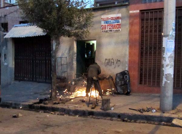 A welder working in the street