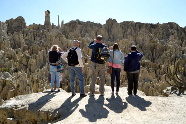 A group of people looking at what is claimed to be a lunar landscape