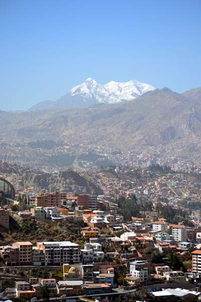 View over the city with a snow-covered mountain in the background