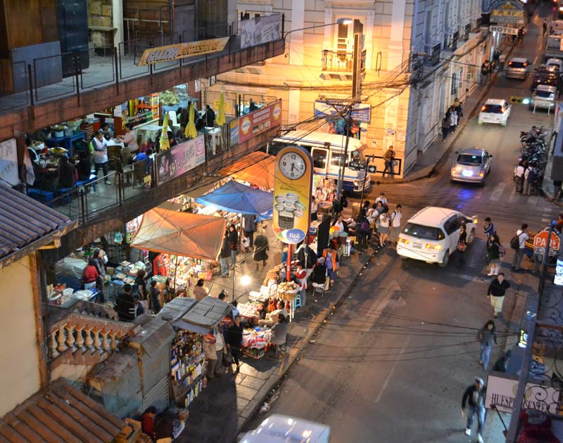 A restaurant and street stalls at night