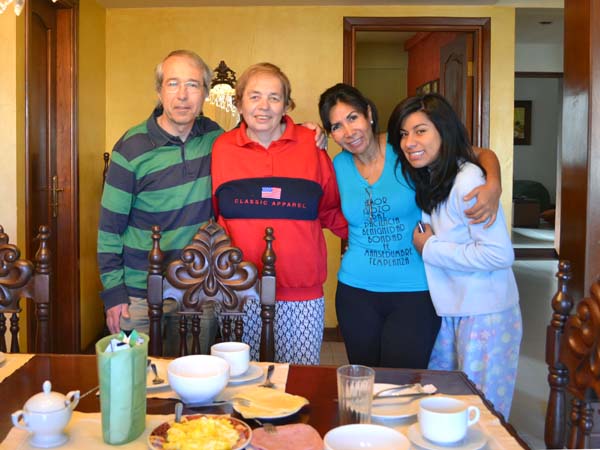 A group standing by a breakfast table