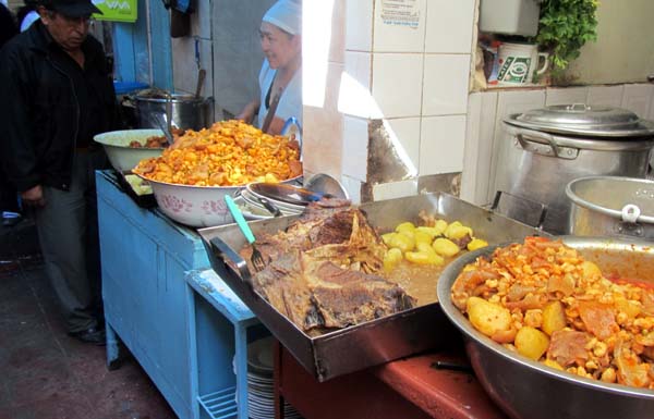 Large open pans of cooked food