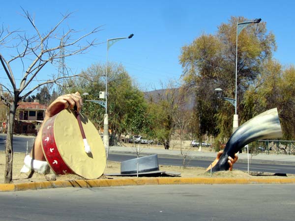 Sculptures of a drum and a horn at the roadside