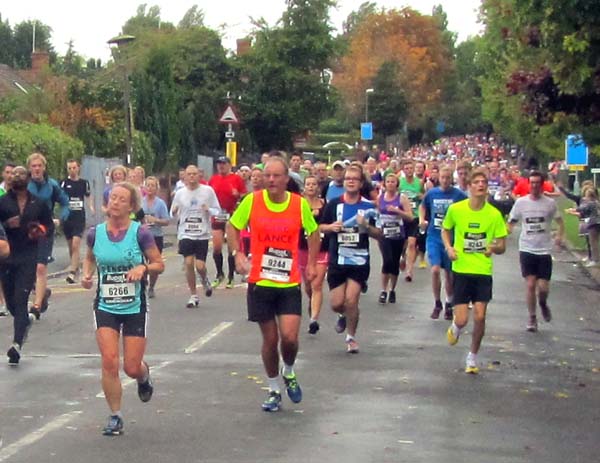 A crowd of runners heading towards the viewer