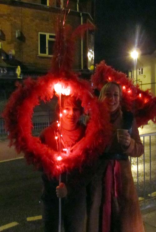 Illuminated red feather decorations