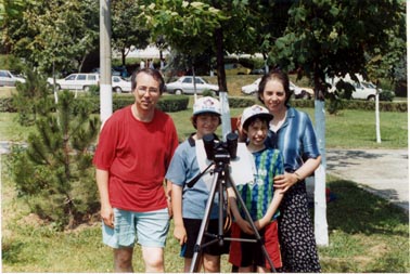 In a park with binoculars mounted on a tripod