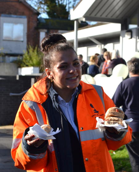 A steward with bacon rolls