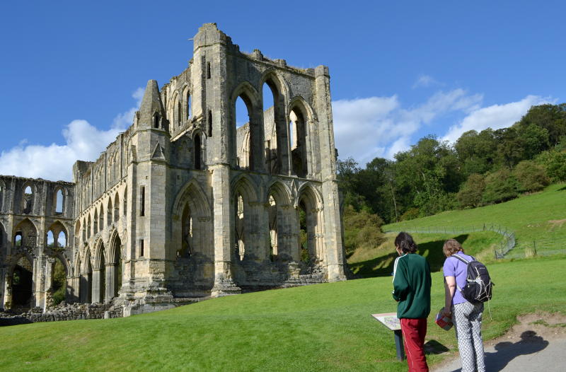 Reading one of the explanatory displays at Rievaulx Abbey