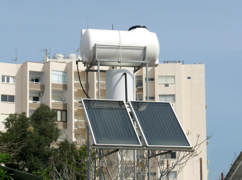 Solar water heating panels and a tank