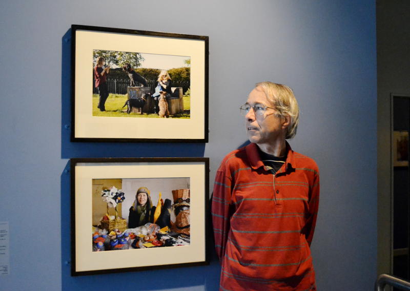 Phil with photos on display at MAC Birmingham