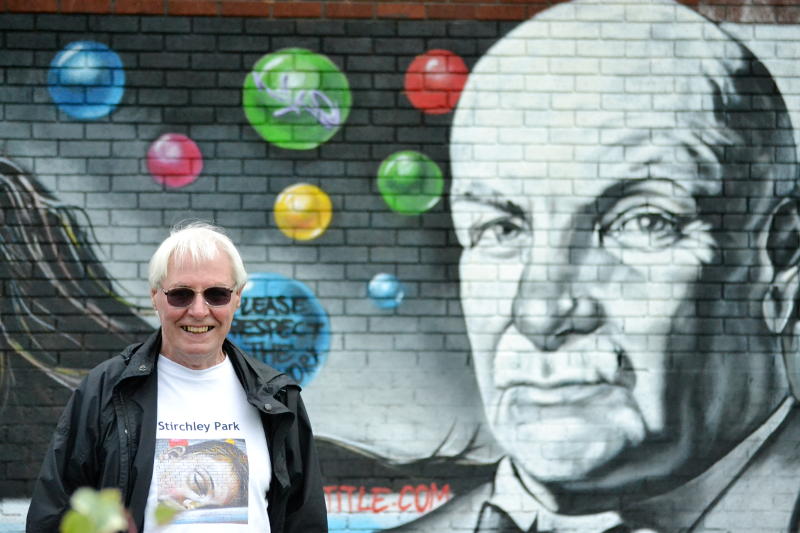 Brian in front of a mural of William Cadbury