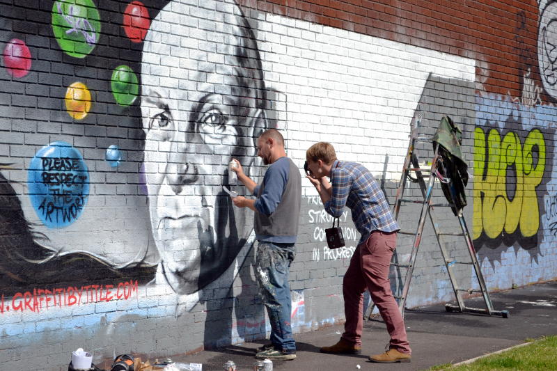 A graffiti artist at work