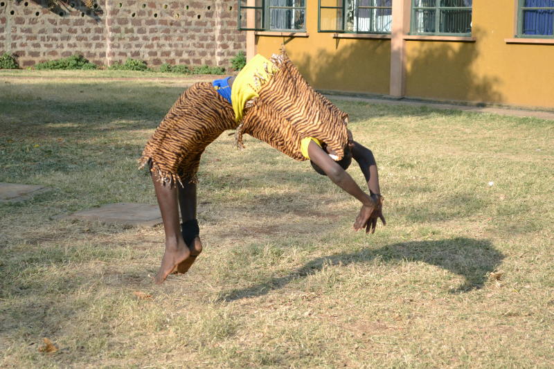 A child doing a somersault during an acrobatic display