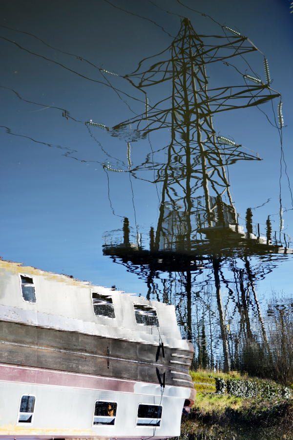 Reflection of an electricity pylon