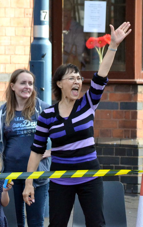 A spectator waving and cheering