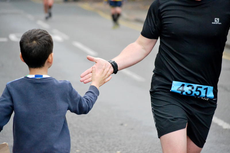 High-fiving a runner