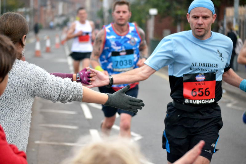 High-fiving runners