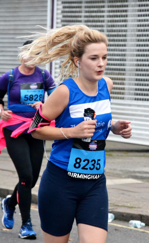 Marathon runner with hair flying in the breeze