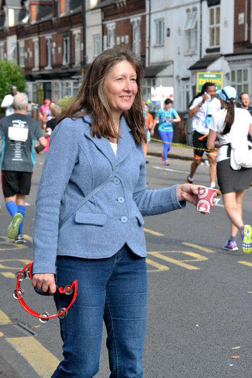 Offering sweets to runners