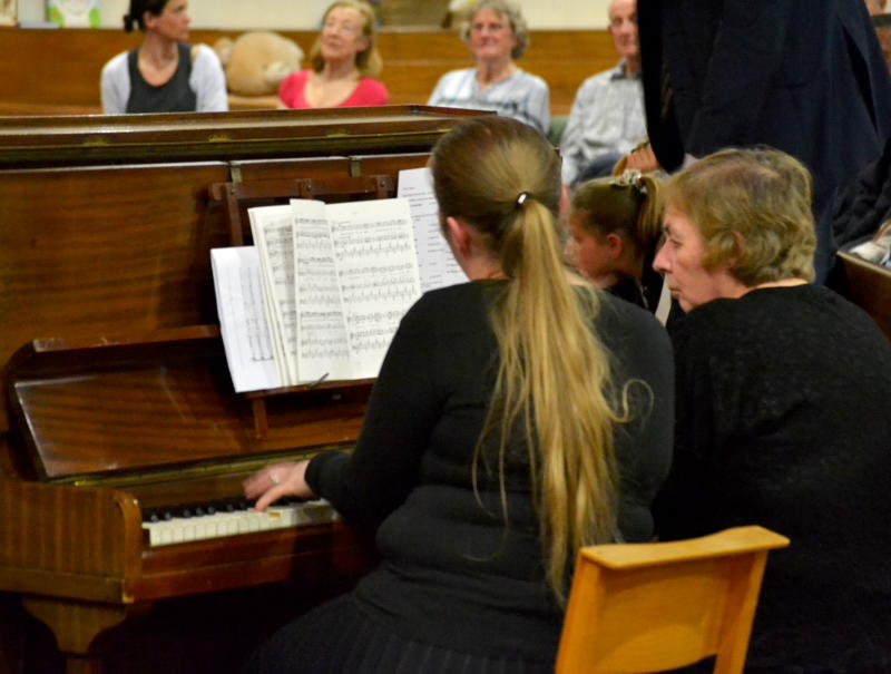 Miriam playing a piano duet