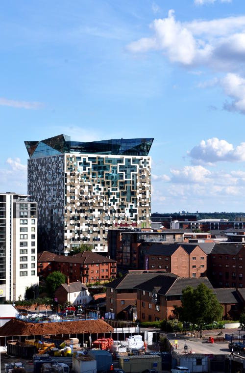 The Cube rises above its surrounding buildings