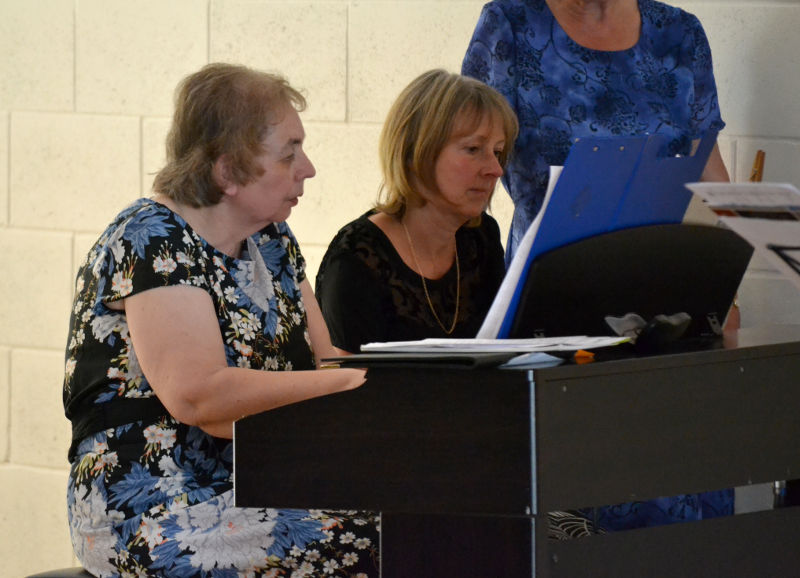 Miriam playing a piano duet