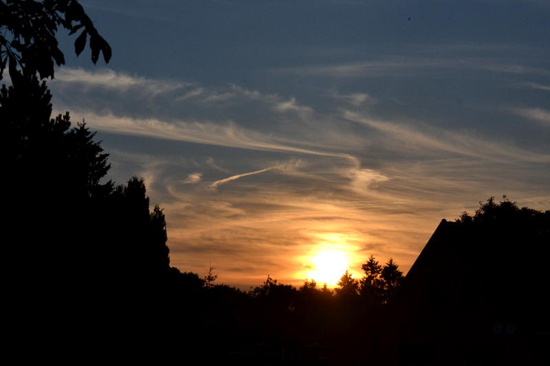 A sunset with low clouds in the sky