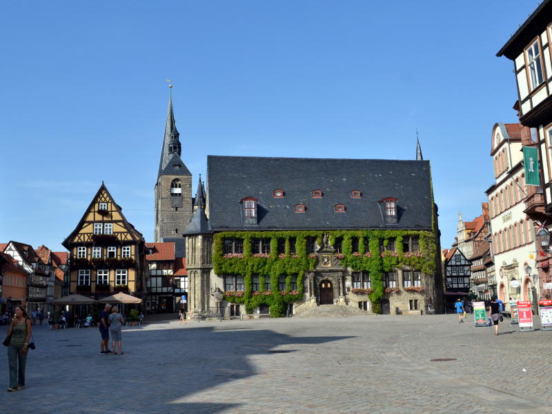 A medieval building at one end of a town square