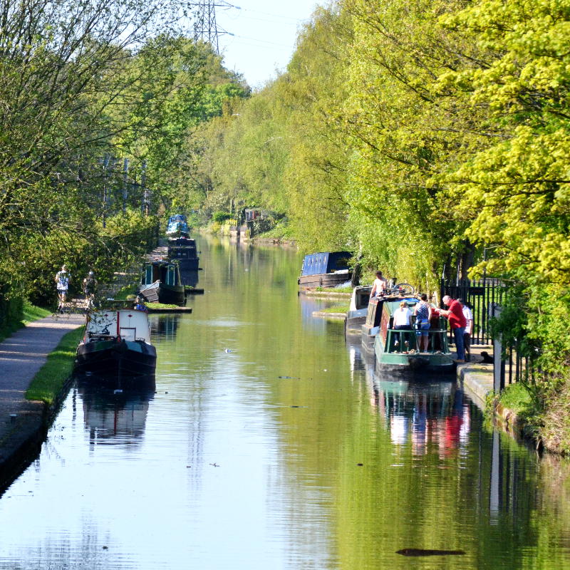 Looking along the canal with boats moored on either side