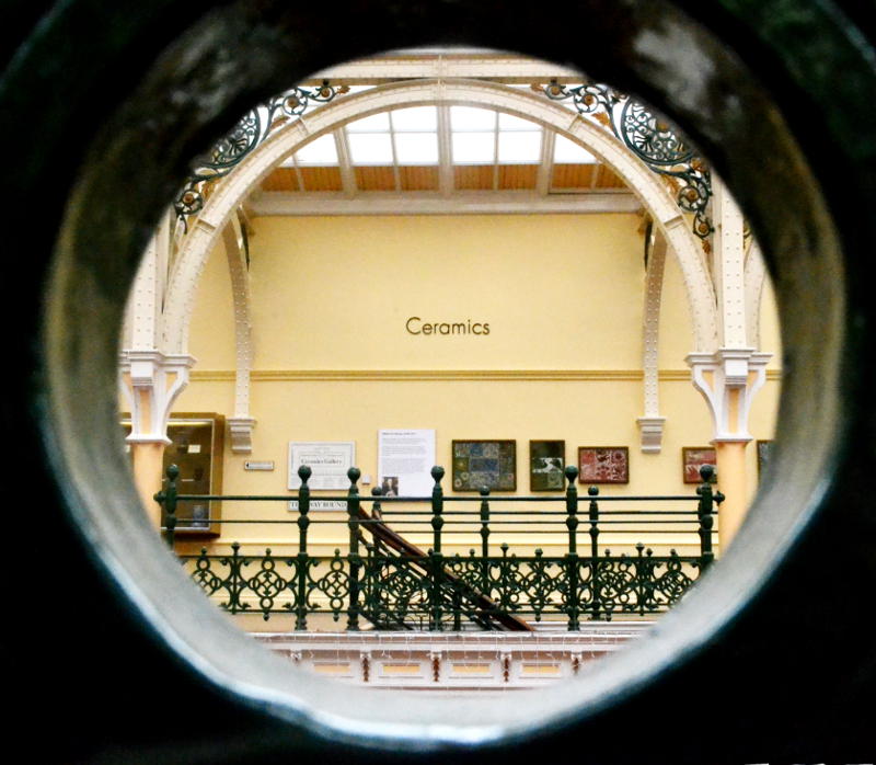 View of one of the galleries at Birmingham Museum and Art Gallery through a circular hole