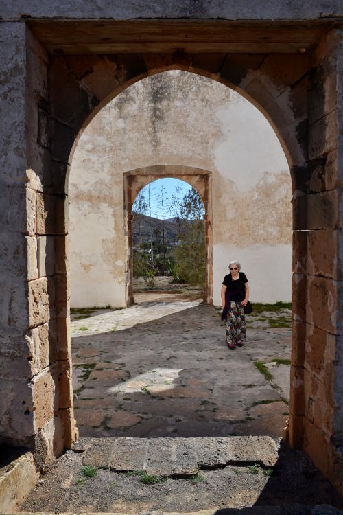 Miriam standing in an abandoned convent