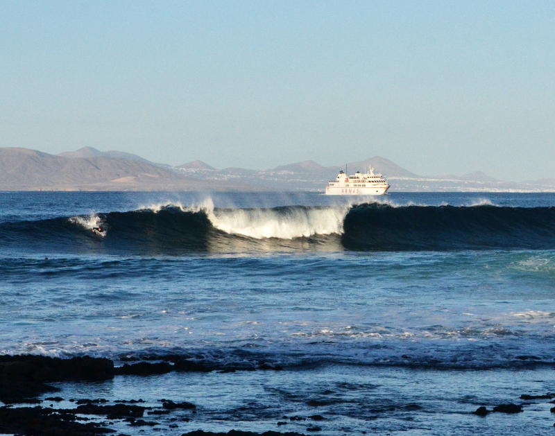 A ferry through a gap in the waves