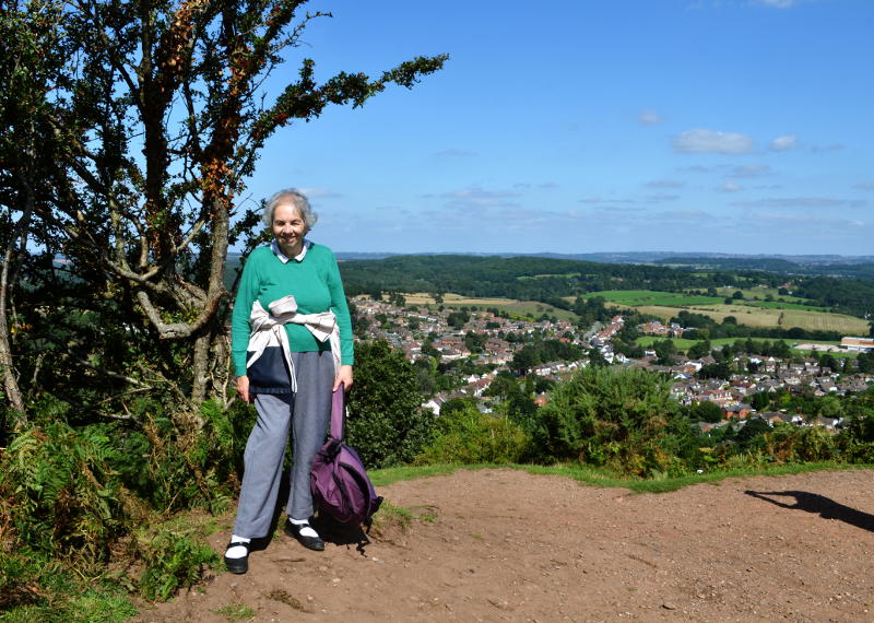 Miriam by a tree with a view over Kinver in the background