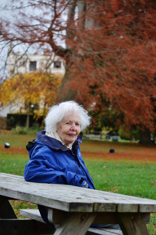 Hanna sitting at a picnic bench at Trentham Gardens