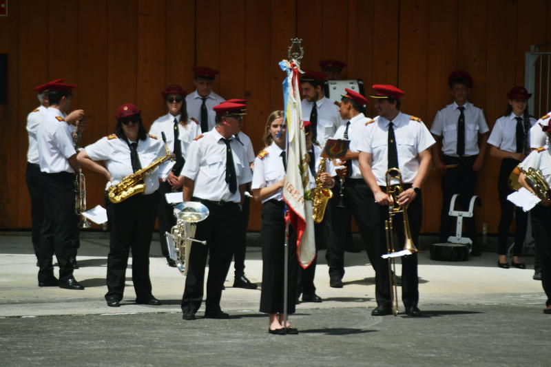 A brass band gathered on a quayside