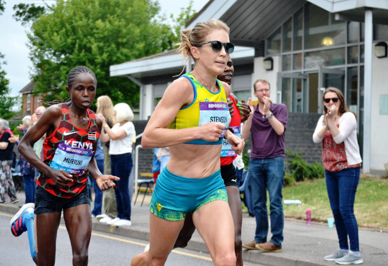 Leading runner Stenson of Australia runs past the Christ Church building and spectators