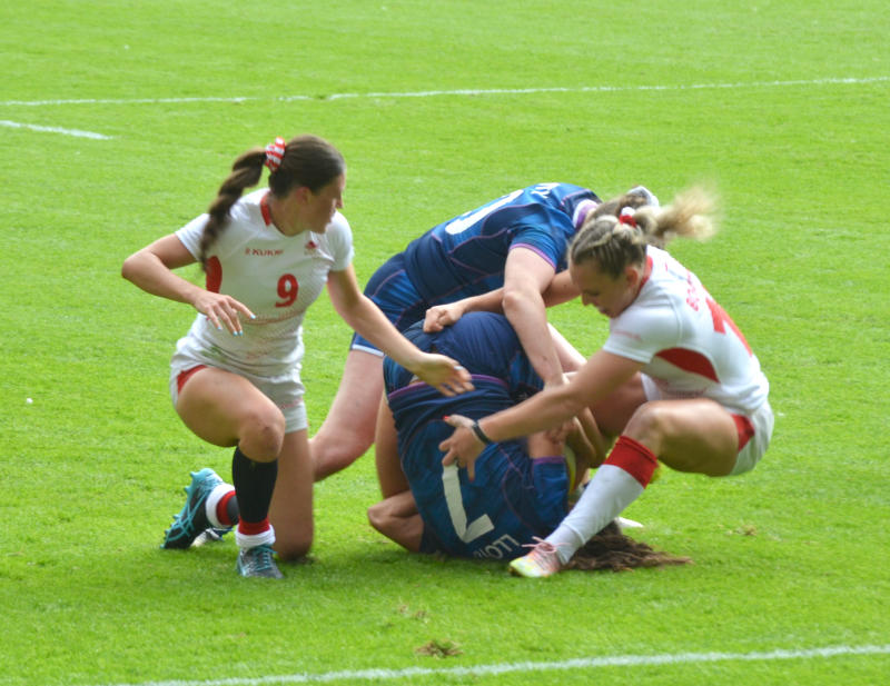 Women rugby players in a maul