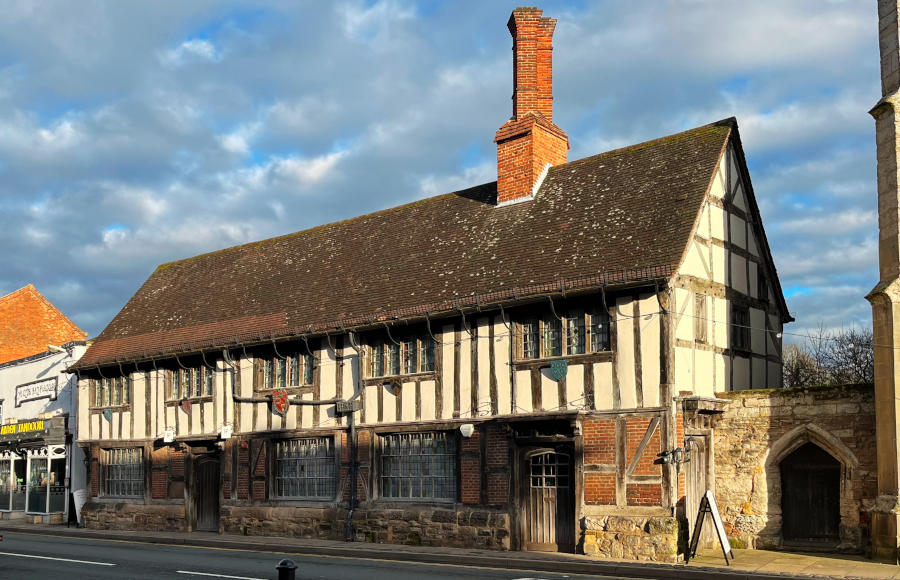 A timber-framed building in sunshine