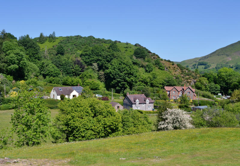 Traditional buildings in a wooded valley